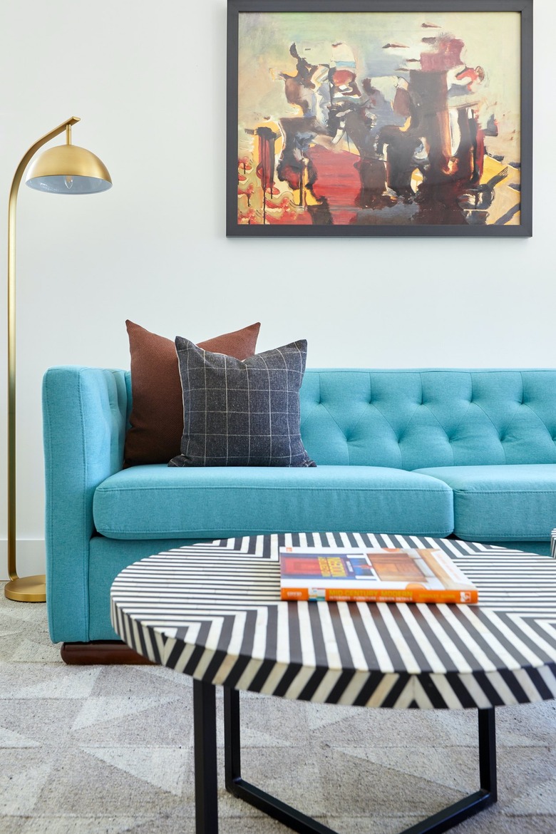 Midcentury modern living room with bright blue modern couch